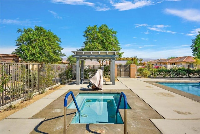 view of swimming pool featuring a pergola, a patio area, and an in ground hot tub