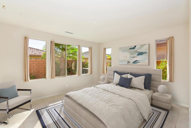 bedroom featuring light tile patterned flooring