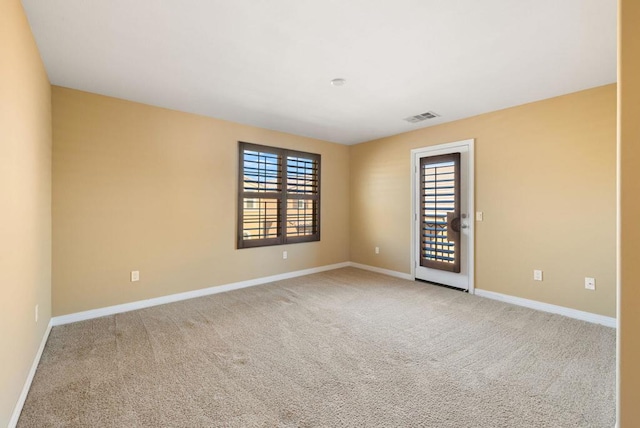 spare room featuring carpet flooring