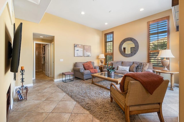 living room with light tile patterned flooring and a healthy amount of sunlight