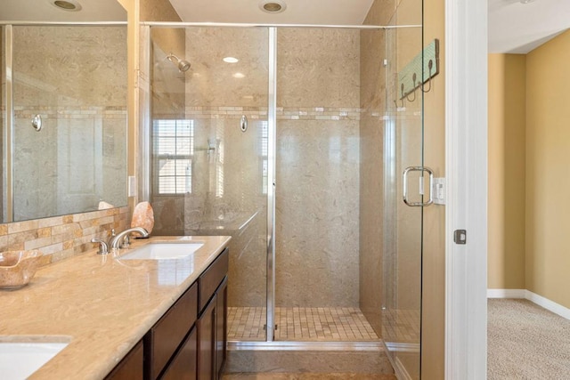 bathroom featuring vanity and a shower with door