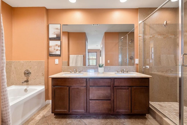 bathroom with vanity, tile patterned floors, and shower with separate bathtub