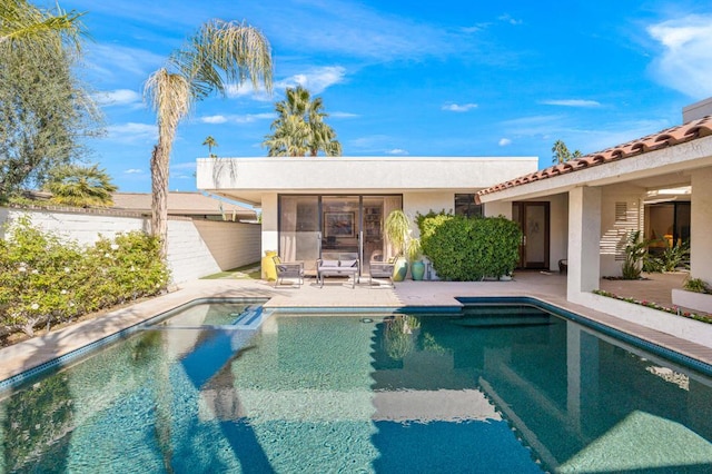 view of swimming pool with a patio area