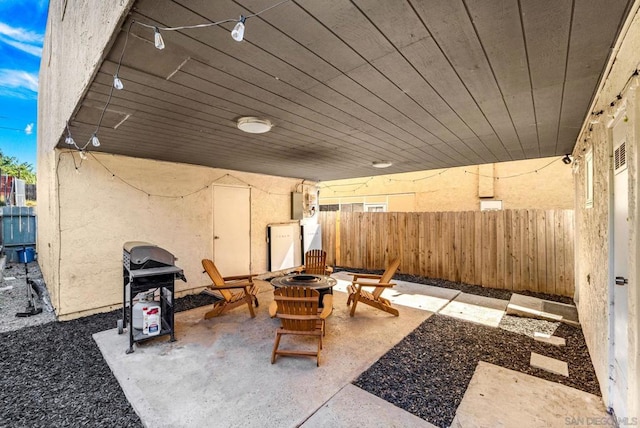 view of patio / terrace featuring grilling area and a fire pit