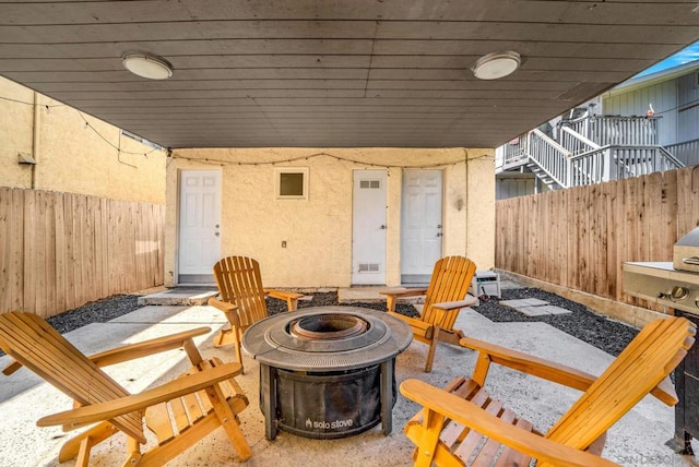 view of patio / terrace with a fire pit