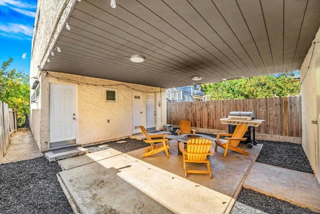 view of patio / terrace with area for grilling and an outdoor fire pit