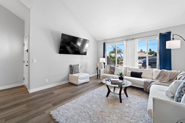 living room featuring high vaulted ceiling and dark wood-type flooring