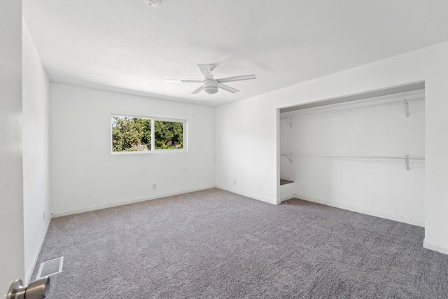 unfurnished bedroom featuring ceiling fan, a closet, and carpet floors