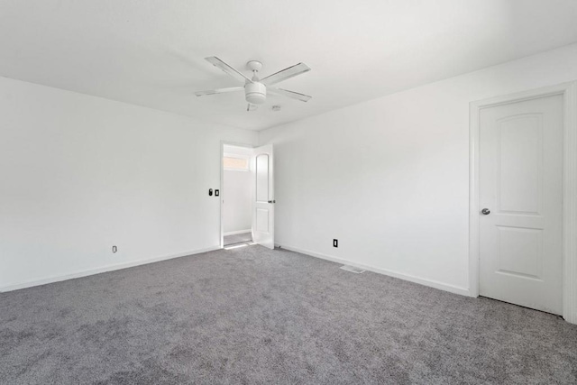 spare room featuring carpet floors and ceiling fan