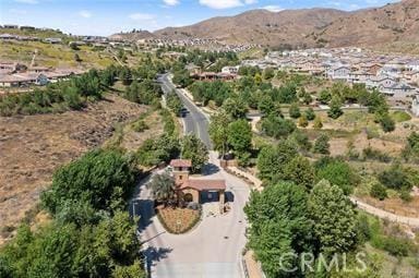 birds eye view of property featuring a mountain view