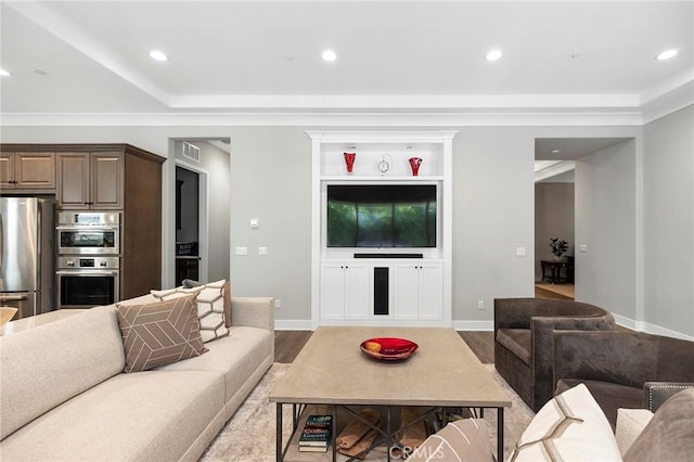 living room featuring hardwood / wood-style flooring and built in features