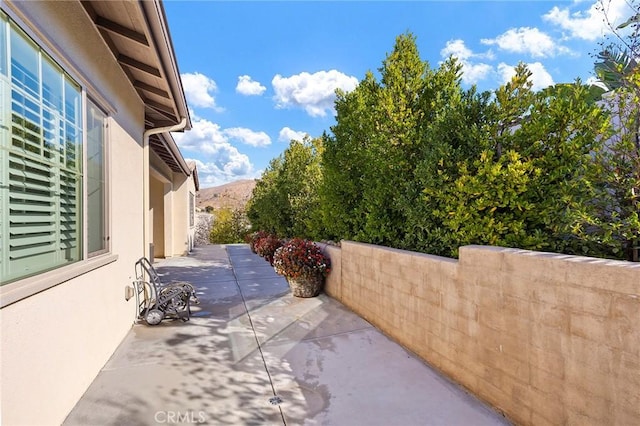 view of patio / terrace with a mountain view