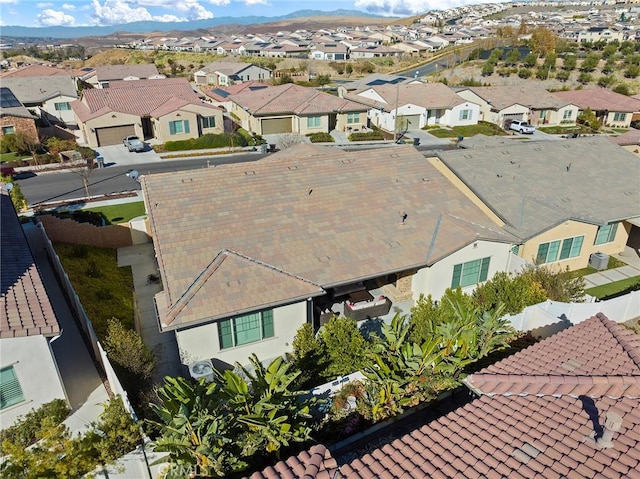 birds eye view of property with a mountain view