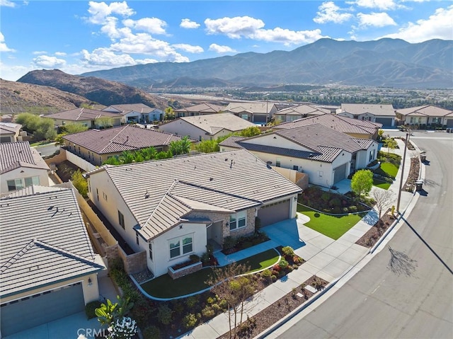 drone / aerial view featuring a mountain view