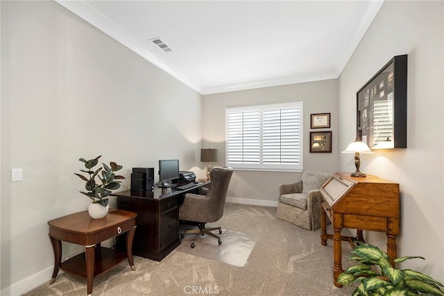 office area with ornamental molding and light carpet