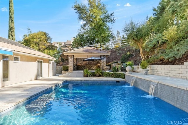 view of pool featuring a gazebo, pool water feature, and a patio