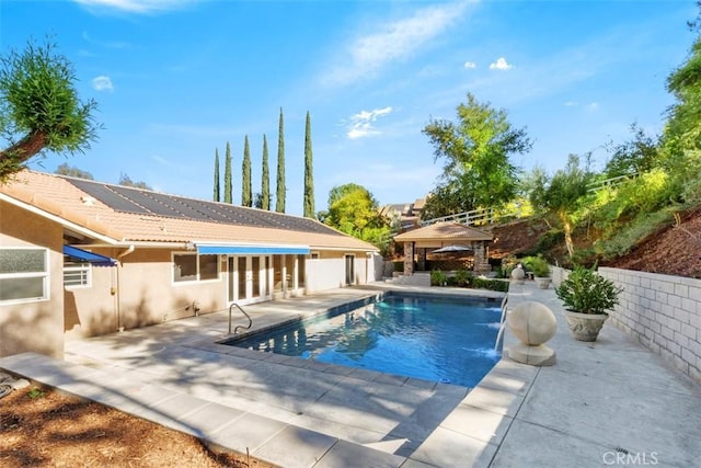 view of swimming pool with a gazebo and a patio