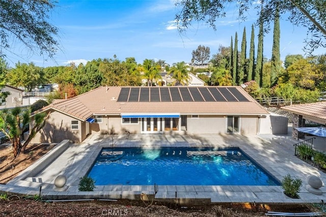 rear view of property featuring a patio area