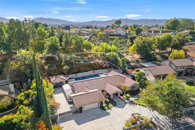 birds eye view of property with a mountain view