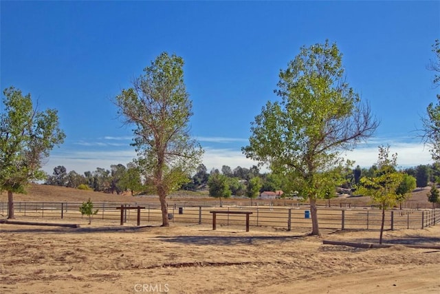 view of yard with a rural view