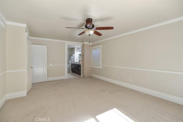 interior space with crown molding, ceiling fan, ensuite bathroom, and light carpet