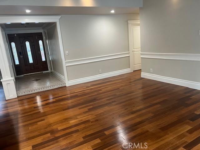 entrance foyer featuring dark wood-type flooring