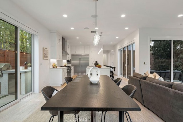 dining room with light wood-type flooring