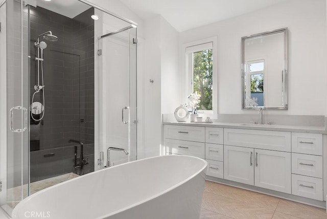 bathroom featuring vanity and separate shower and tub