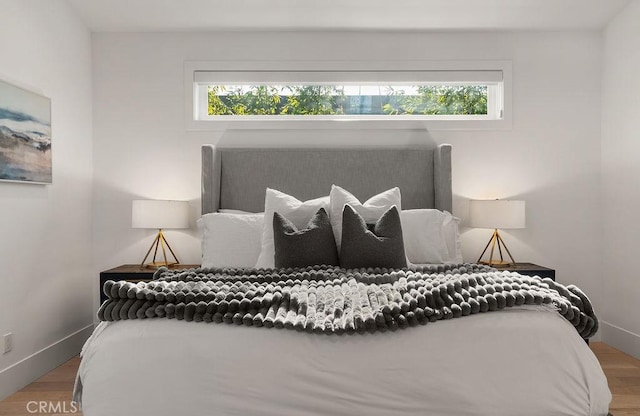 bedroom with wood-type flooring