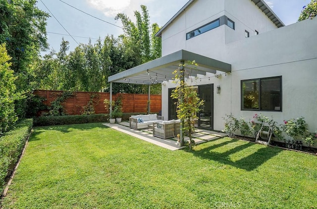 view of yard featuring an outdoor living space and a patio area