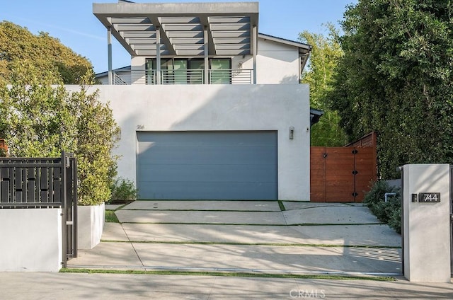 contemporary house with a balcony and a garage