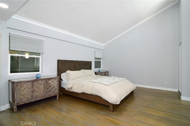 bedroom with lofted ceiling, dark hardwood / wood-style flooring, and crown molding