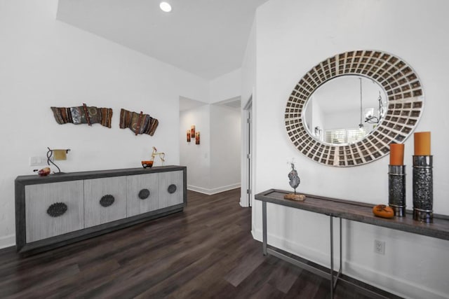 corridor featuring dark hardwood / wood-style floors