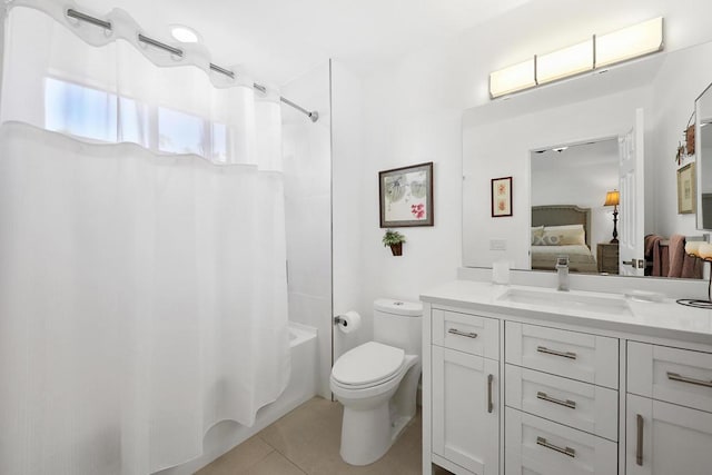 full bathroom featuring toilet, tile patterned floors, vanity, and shower / bathtub combination with curtain