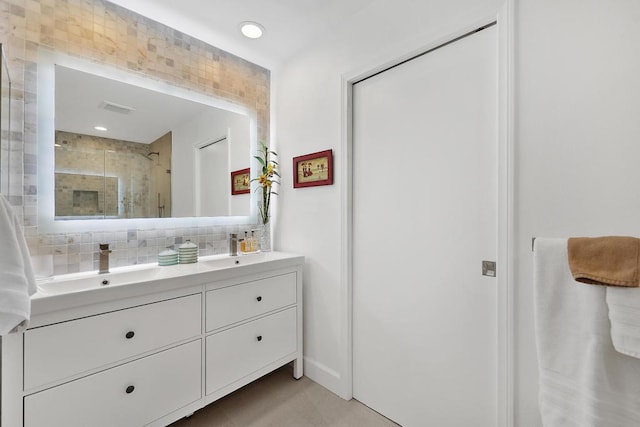 bathroom with an enclosed shower and vanity