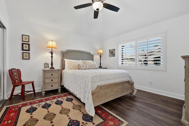 bedroom featuring ceiling fan and dark hardwood / wood-style floors