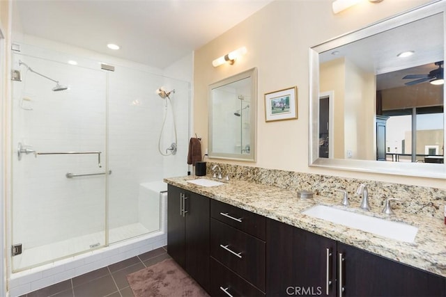 bathroom featuring ceiling fan, a shower with door, vanity, and tile patterned flooring