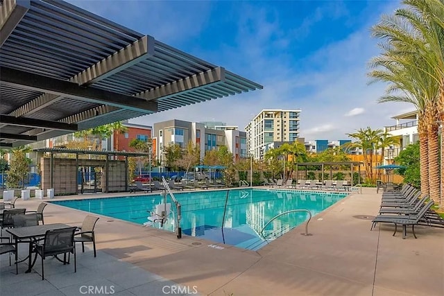 view of swimming pool with a pergola and a patio area