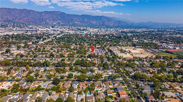 birds eye view of property with a mountain view