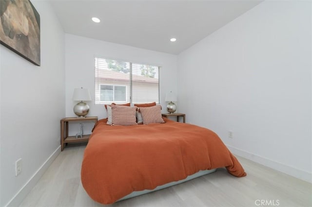 bedroom featuring light hardwood / wood-style floors