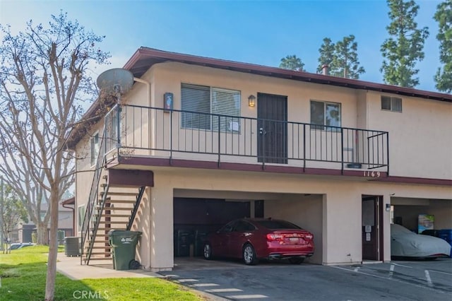 rear view of property with a garage