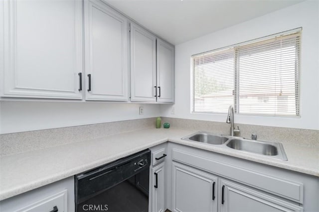 kitchen with sink, white cabinets, and dishwasher