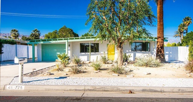 single story home featuring a garage