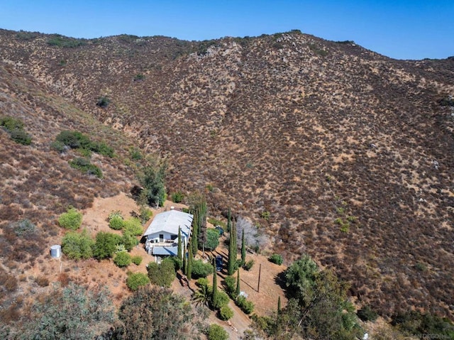 birds eye view of property featuring a mountain view