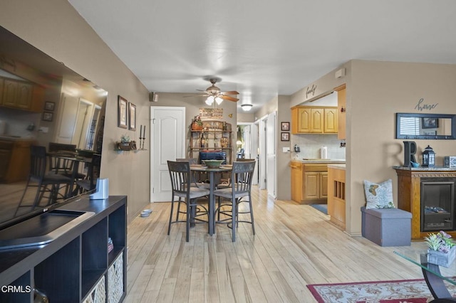 dining area featuring ceiling fan and light hardwood / wood-style flooring