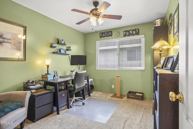 carpeted home office with ceiling fan