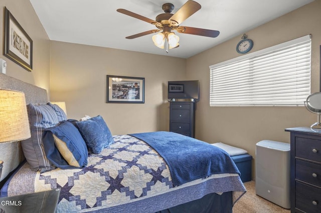 bedroom featuring ceiling fan and light colored carpet