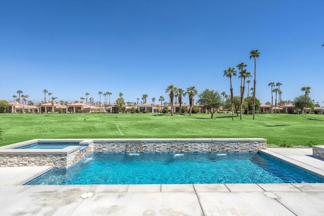 view of pool featuring pool water feature, an in ground hot tub, and a yard