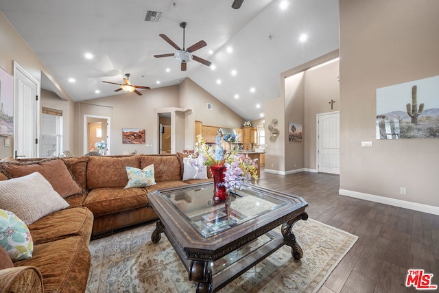 living room with high vaulted ceiling, ceiling fan, and dark hardwood / wood-style floors