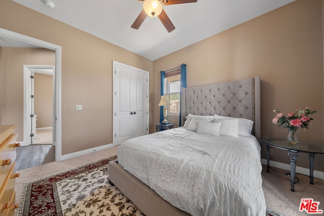 carpeted bedroom featuring ceiling fan